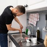 How to Unclog a Garbage Disposal With Standing Water