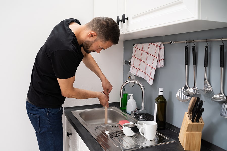 How to Unclog a Garbage Disposal With Standing Water