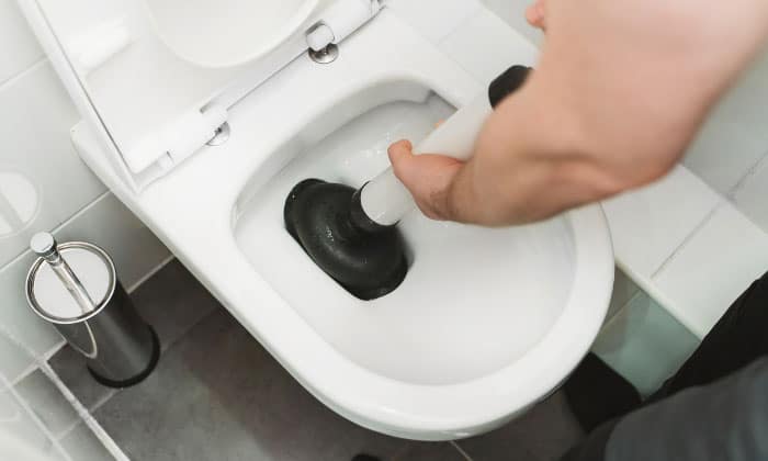 How to Unclog a Toilet That’s Backing Up Into the Bathtub